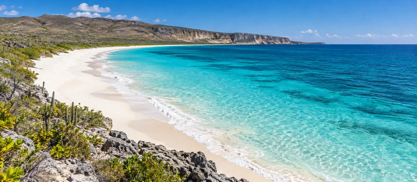 Exposed remote beach and turquoise water at Bahía de las Águilas in Pedernales